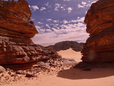landscape of sands surrounded by rocksの写真素材