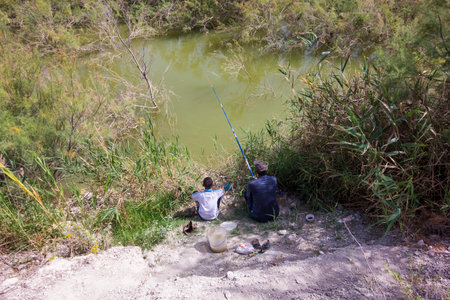 Two Fishermen by the Riverの写真素材