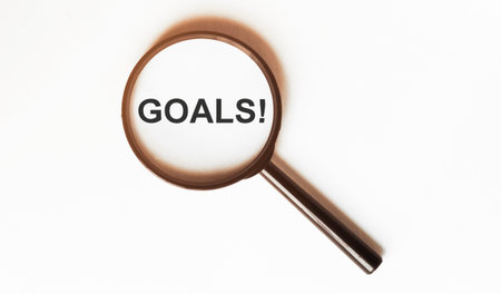 Goals on a sheet under a magnifying glassの写真素材