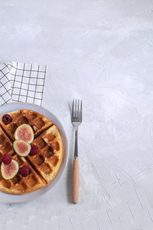 Belgian waffles Slow food breakfast concept figs raspberries honey Espresso coffee Checkere napkin...