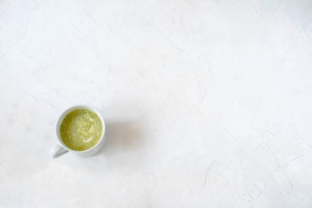 Healthy green tea matcha latte in white , top view,  , white background, minimal picture.