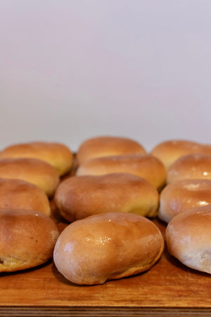 Fresh baked homemade traditional russian pies pirozhki, close-up, selective focus