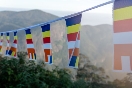 Closeup of buddhist flags near Adams peak, Sri Pada, sacred buddhist mountain, Sri Lanka, travel destinationの写真素材