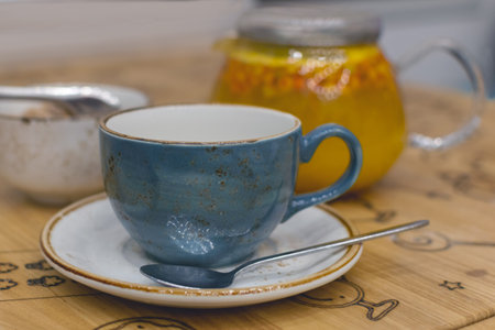 Winter warming drink - teapot with vitamin sea buckthorns hot tea, natural flue cold treatmentの写真素材