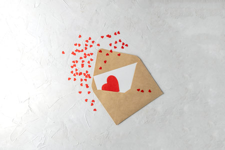Valentines mother womens day minimal concept, hanmade gift - craft envelope, paper note, red paper...
