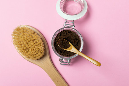 Skincare concept, weight loss - natural organic anticellulite coffee scrub in glass jar, wooden...