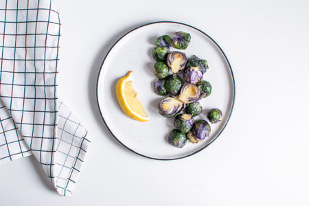 Healthy food concept, dieting, vegetarian, vegan - organic purple brussel sprouts fried on plate...