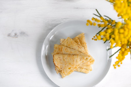 Morning, breakfast - traditional russian blini pancakes, french crepes, white wooden table, top viewの写真素材