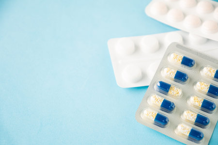 Selective focus on medical pills on blue
