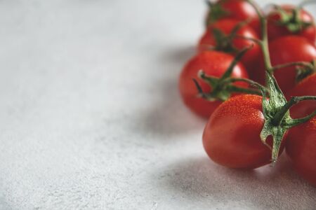 Fresh ripe organic tomatoes on light background, copy spaceの写真素材