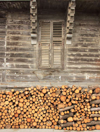 wood at the front of wooden cottageの写真素材