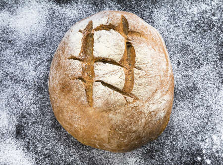 homemade brown bread on black backgroundの写真素材