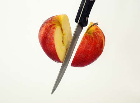 An Apple cut by knifeの写真素材
