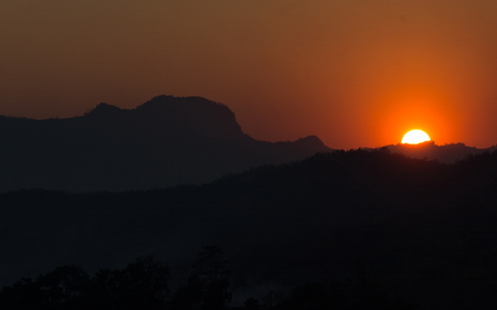 Silhouette mountain with sunsetの写真素材