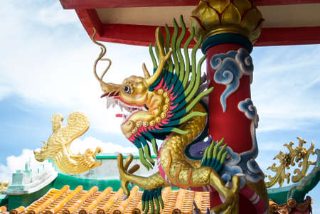 Dragon at pole, Chinese temple in Thailand.の写真素材