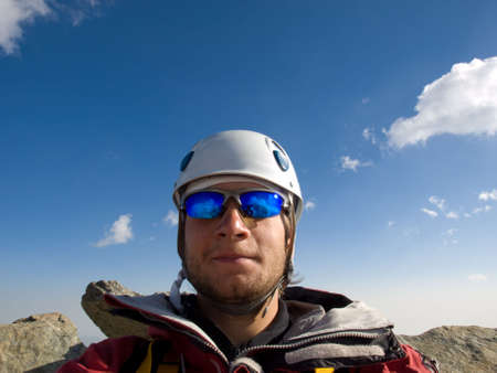 Climber on the top of mountain. の写真素材