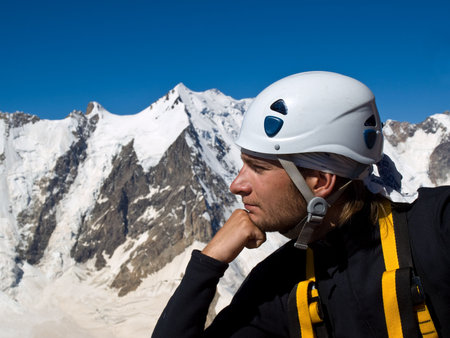Climber on the top of mountain. Thinkerの写真素材