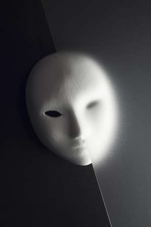 plaster mask in studio, when compared to the good or bad の写真素材