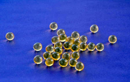 Vitamins fish oil on a blue backgroundの写真素材