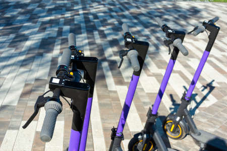 Electric scooter rental in the parking lot, active recreation, city life, electric scooter rental.の写真素材