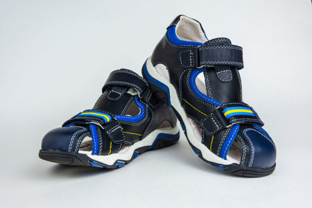 Children's sandals isolated on a white background. Children's shoes. Dark blue color.