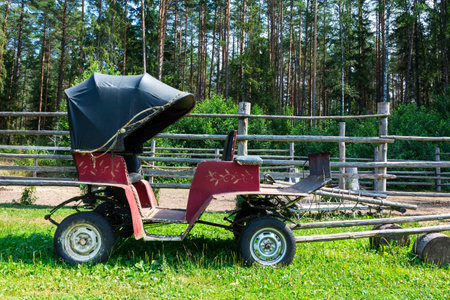 Old vintage passenger carriage for horse harnessing.