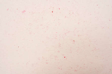 Laconic beige background with red flecks, cream background.の写真素材