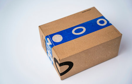 cardboard box sealed with blue adhesive tape from the delivery service
