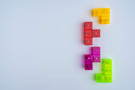 three-dimensional colored tetris figures on a white background, space for copyingの写真素材