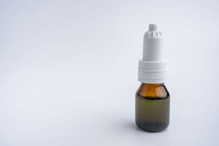 a bottle of aromatic oil on a white background. a bottle with a medicinal productの写真素材