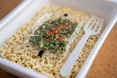 Chinese noodles with a bag of dried vegetables. close-up. Instant noodlesの写真素材