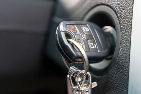 the car ignition key inserted into the car lock.の写真素材