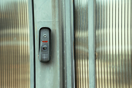 intercom panel with a video camera on the brick fence of private houseの写真素材