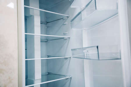 empty shelves of an open refrigerator. a new refrigeratorの写真素材