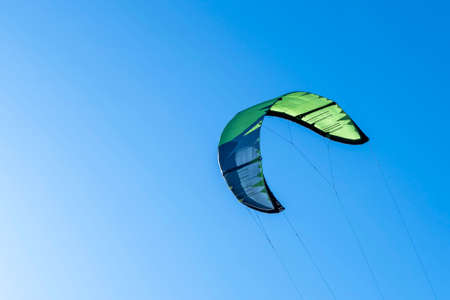 wing of kitesurfing against the blue sky . Kitesurfing on the seaの写真素材