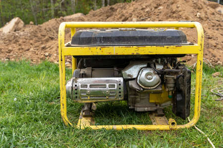 portable gasoline generator operating on a construction siteの写真素材
