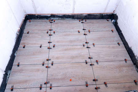 close-up of the tile alignment system holding tile in given positionの写真素材