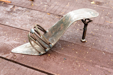 Pskov region. July 27, 2022: iron womens shoe made by a masterのeditorial素材