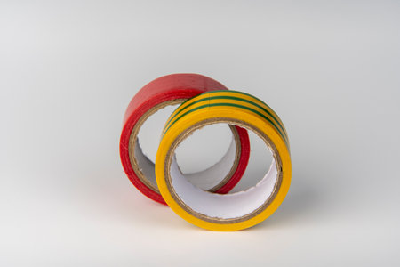 red vinyl insulating electrical tape on the white backgroundの写真素材