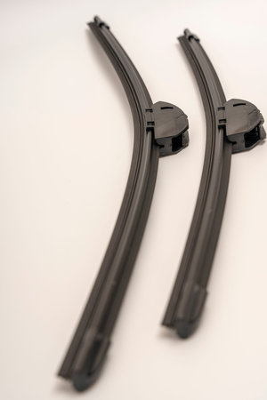 frameless car wiper blades on a white background.