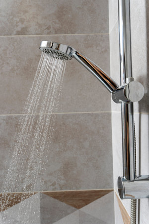 water pours from the shower head. shower-bath. Close up