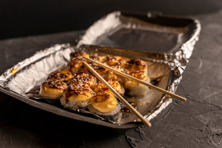 Sushi rolls in a plastic thermo container. Takeaway food