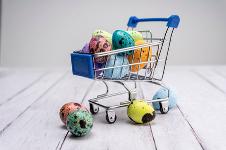 Colorful Easter eggs in a supermarket cart. Easter greeting cardの写真素材