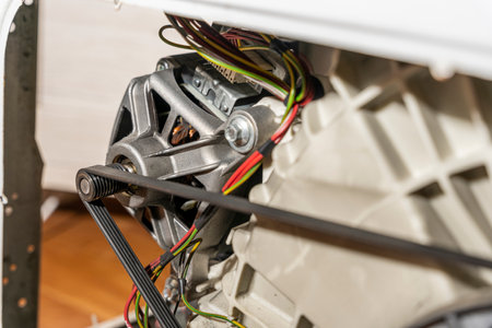 Electric motor and belt drive of an electric washing machineの写真素材
