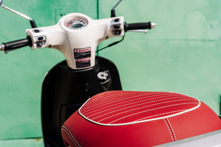 scooter. rear view of a scooter with a beautiful red leather seat