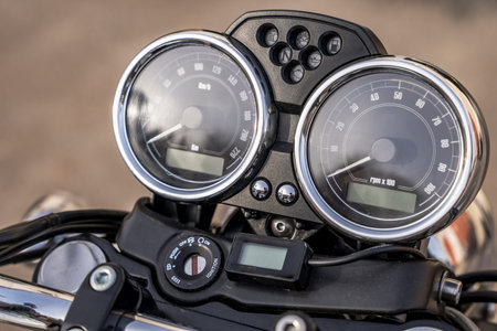 The dashboard of a classic motorcycle. Speedometer and tachometer