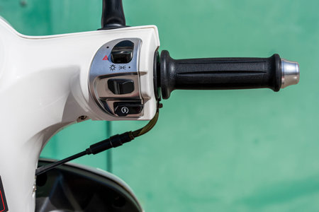 throttle handle on the handlebars of the scooterの写真素材