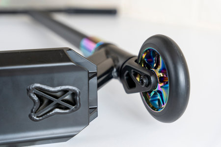 stunt scooter with rainbow-colored wheels. Sale and repair of scootersの写真素材