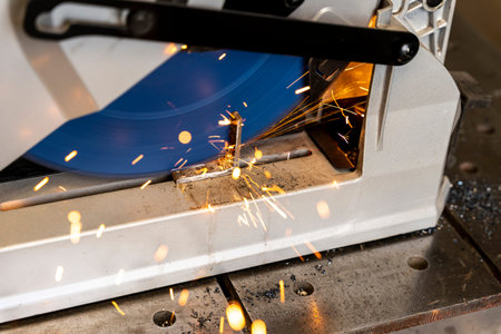 metal saw with tool cutting disc makes a cut