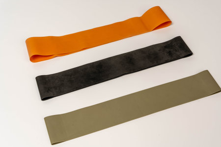 Fitness resistance bands set for training on white background with copy space